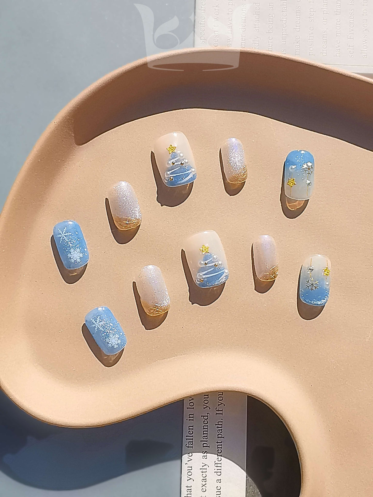 Luxurious nails with a monochromatic color scheme, featuring pearls, rhinestones, geometric patterns, 3D elements, and mixed textures for a high fashion statement.