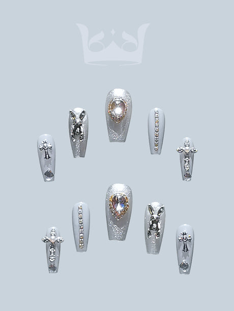 Luxurious and glamorous nails with rhinestones, diamonds, metallic accents, 3D elements, glitter, shimmer, varied patterns, and accent nails for special occasions.