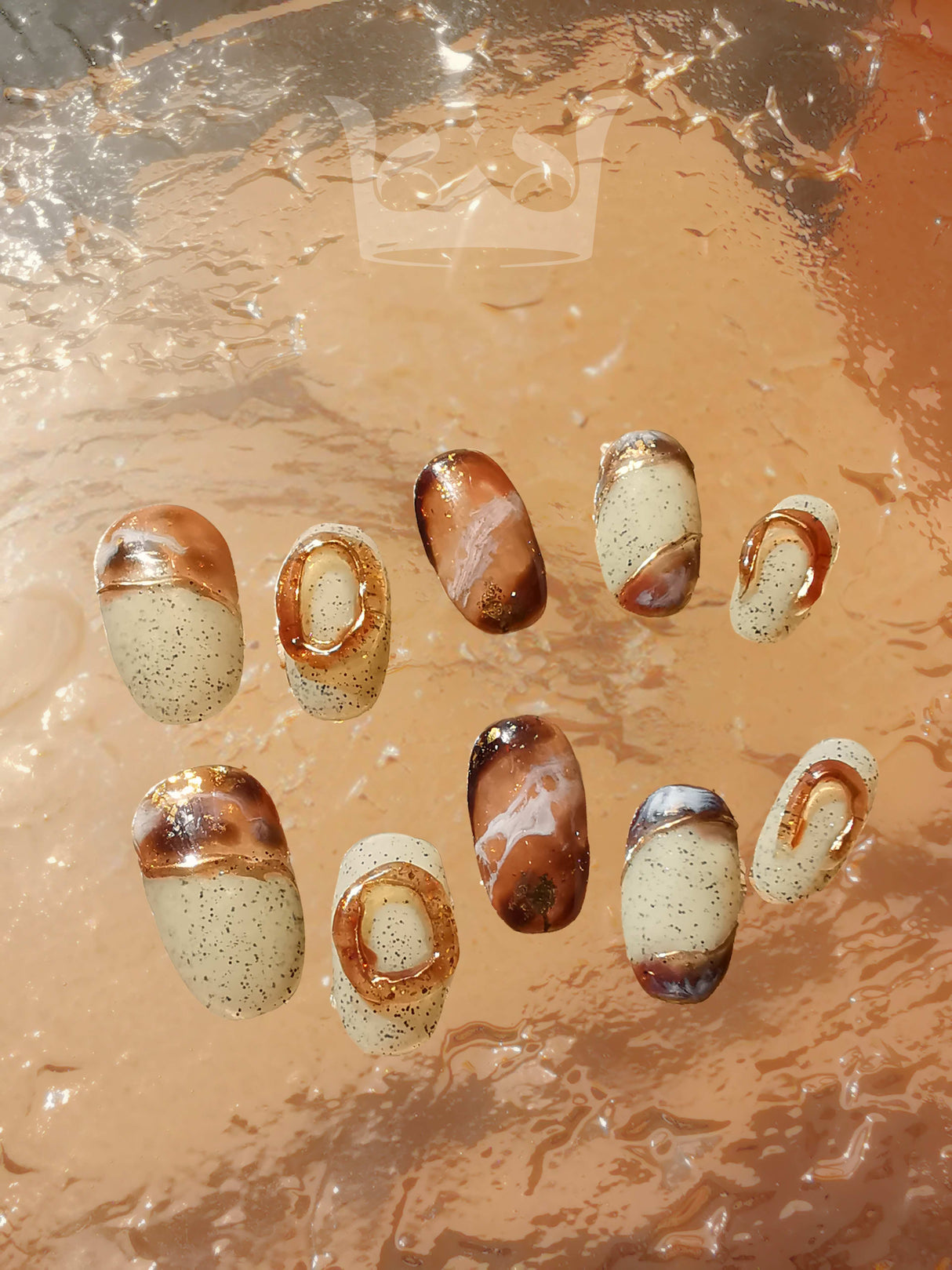 Oval medium-length press-ons with hand-painted marble effect. Painted with a netruel color pallate and stone-like background. Best nail art design in 2024.