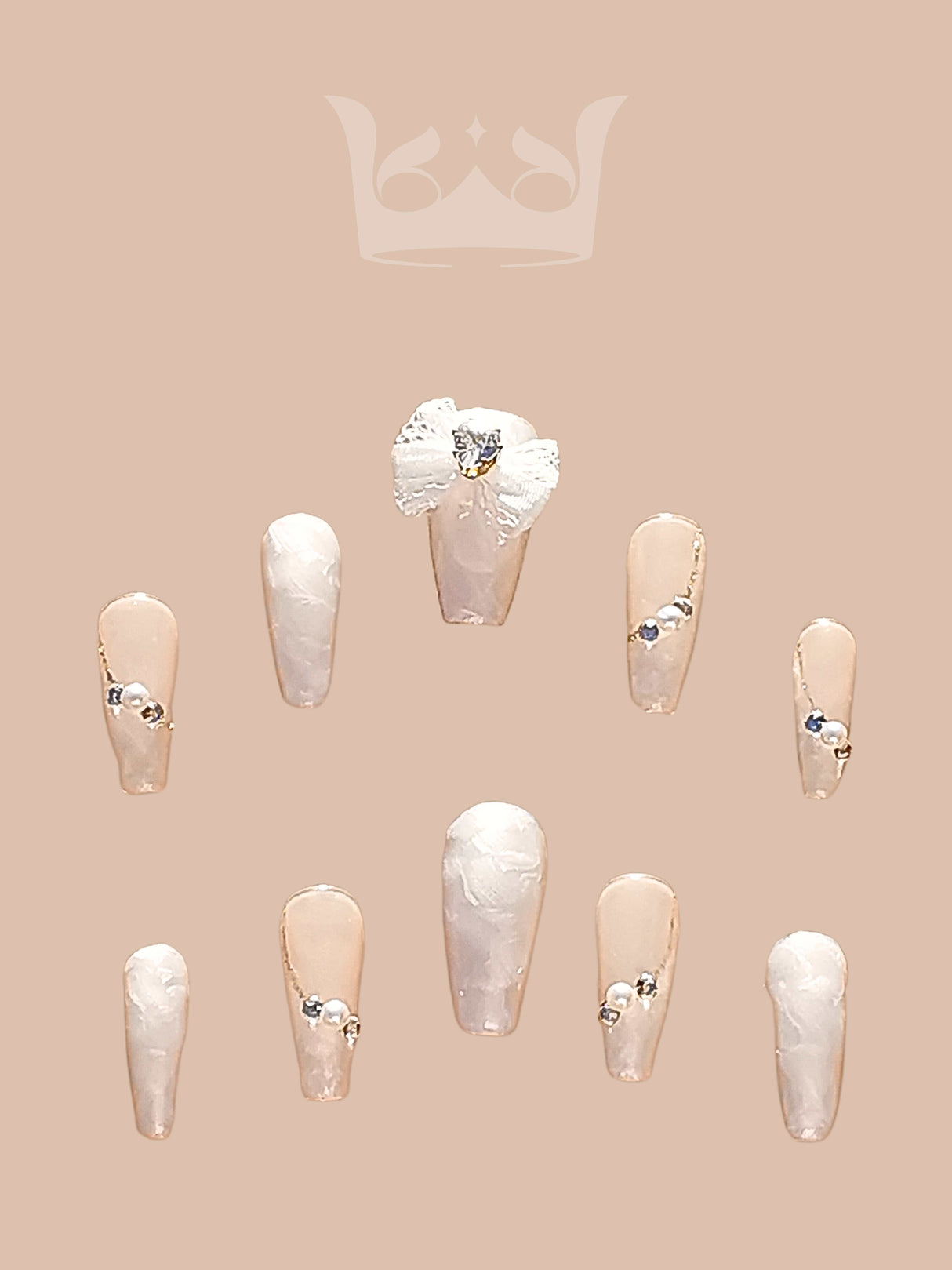 These press-on nails are perfect for formal occasions like weddings or proms. They have a minimalist design with diamonds and a glossy finish for added elegance.