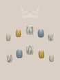 These press-on nails have a minimalist and modern aesthetic with color, texture, pattern, and shape as design elements.