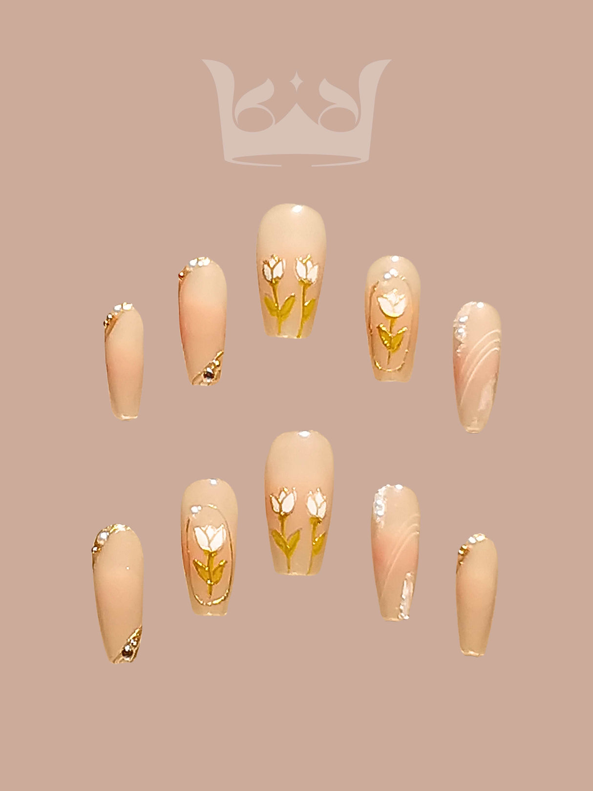 These press-on nails are perfect for special occasions, with a soft neutral base color, delicate floral art, gold accents, marbled effect, and glossy finish.