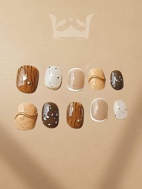 These press-on nails offer a modern twist on the classic French manicure with pastel colors and small embellishments for a chic and playful look. Suitable for any occasion.