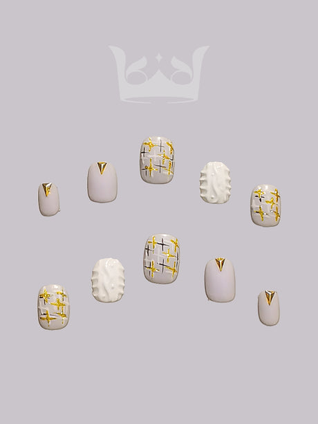 These press-on nails come in a versatile color palette and with gold metallic accents for a touch of luxury. Ideal for balancing understated elegance with statement-making style.