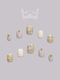 These press-on nails come in a versatile color palette and with gold metallic accents for a touch of luxury. Ideal for balancing understated elegance with statement-making style.
