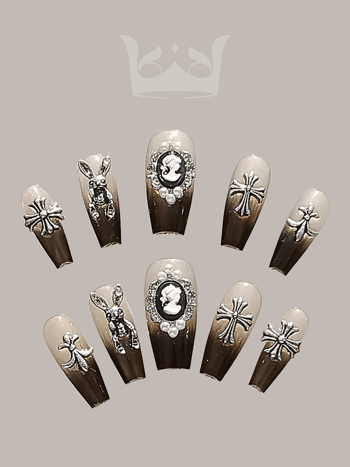 These press-on nails are designed for special occasions, featuring trendy designs with cameo, rhinestone, metallic, and insect motifs, and a glossy finish.