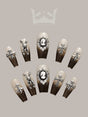 These press-on nails are designed for special occasions, featuring trendy designs with cameo, rhinestone, metallic, and insect motifs, and a glossy finish.