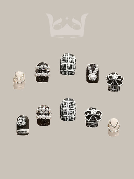 Luxurious and ornate nails with pearls, beads, geometric patterns, jewel embellishments, mixed textures, accent nail, and symmetry for a bold fashion statement or special occasion.