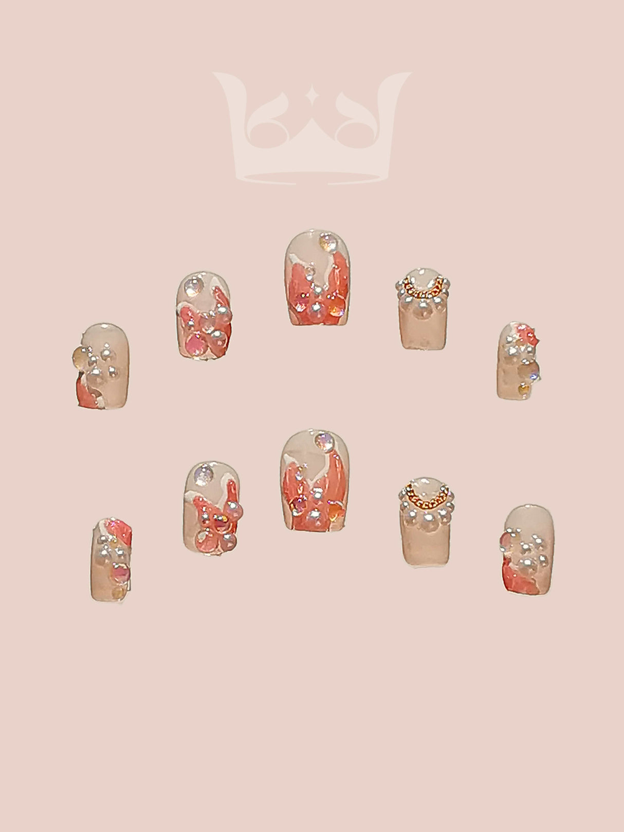 Elegant and feminine nails with floral patterns, gold accents, and rhinestone decorations for special occasions or personal style expression.