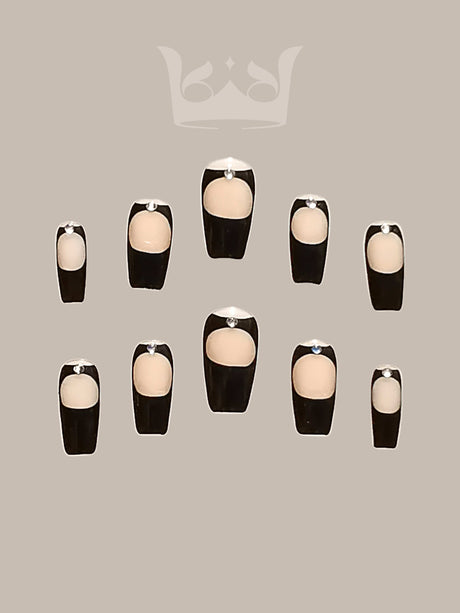 These press-on nails offer a modern twist on the French manicure with dark tips and a nude base, suitable for formal occasions or everyday wear. Square or squoval shape.