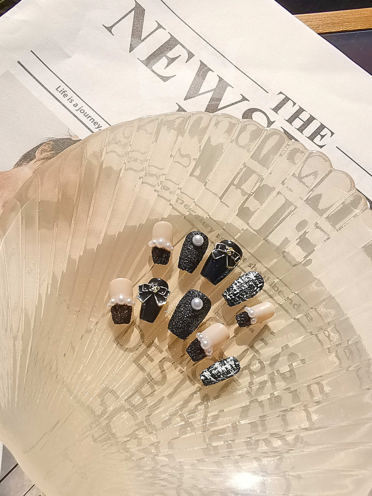 Fashion-forward individuals can make a statement with these fancy and stylish nails featuring a neutral color palette, accent nails, textures, and embellishments.