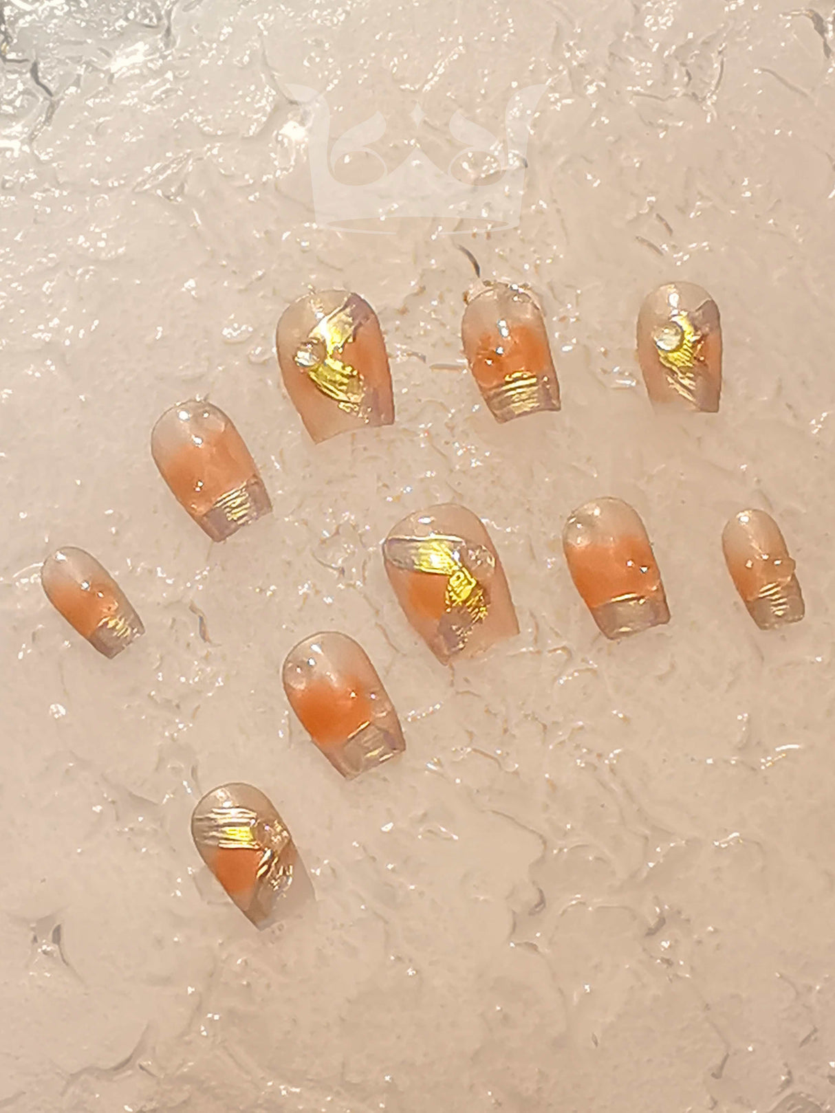 These press-on nails are suitable for formal events. The natural polish color and accent design create a fancy and stylish look. They have rounded shape and gold embellishment.