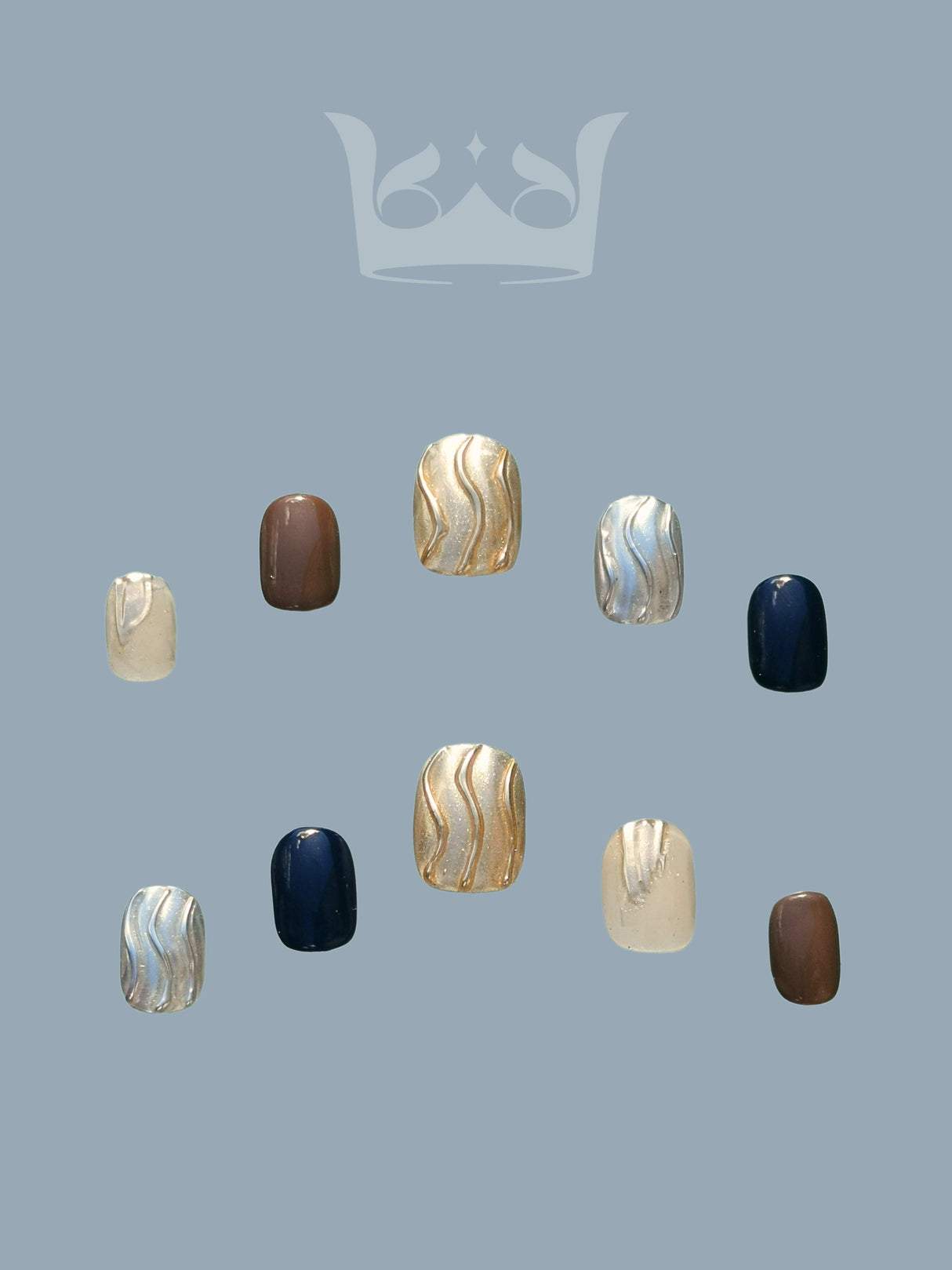 Luxurious nails with a monochromatic color scheme, featuring pearls, rhinestones, geometric patterns, 3D elements, and mixed textures for a high fashion statement.