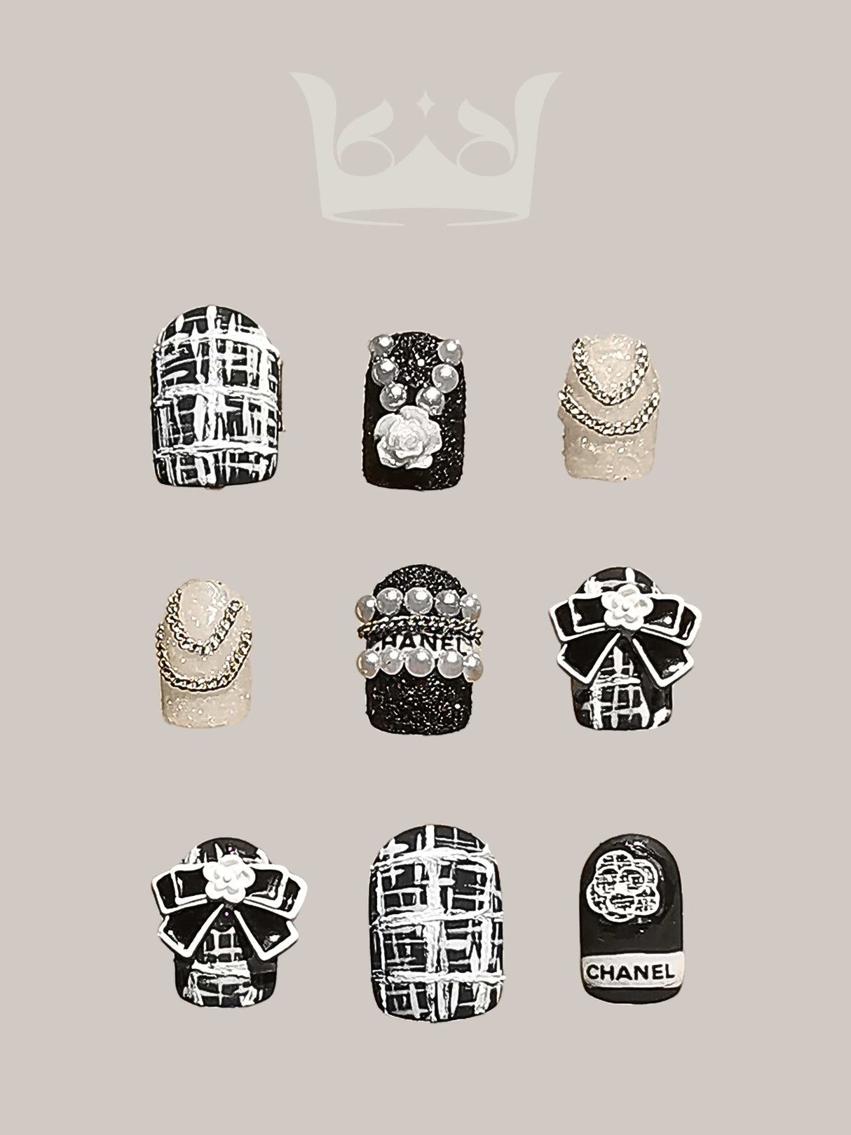 Luxurious nails with a monochromatic color scheme, featuring pearls, rhinestones, geometric patterns, 3D elements, and mixed textures for a high fashion statement.