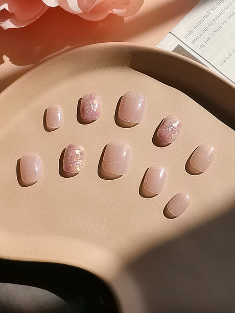 These press-on nails have gold embellishments, abstract lines, and textured patterns, creating a luxurious appearance suitable for formal events or stylish outfits.