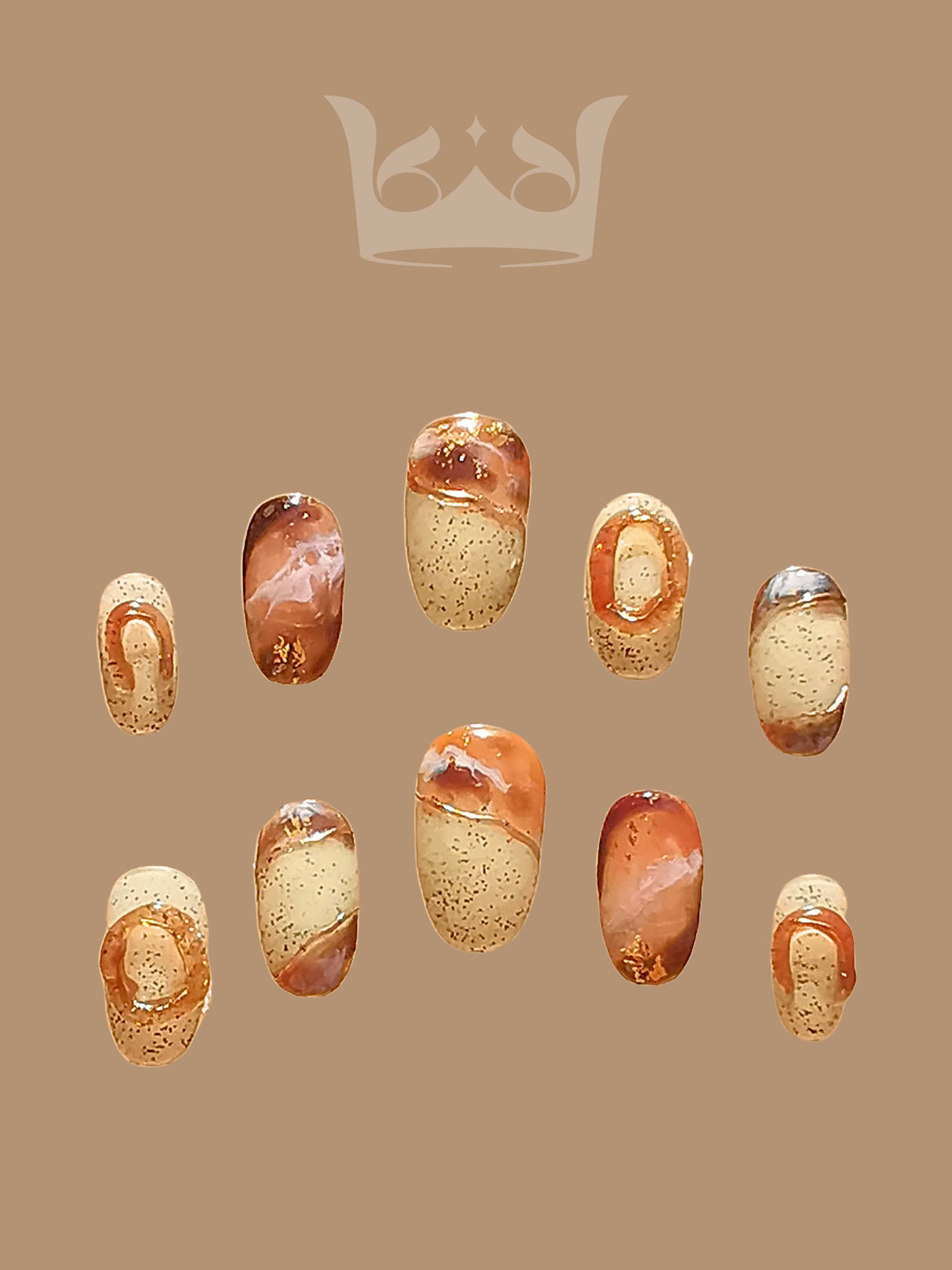 Oval medium-length press-ons with hand-painted marble effect. Painted with a netruel color pallate and stone-like background with sculpted rings.