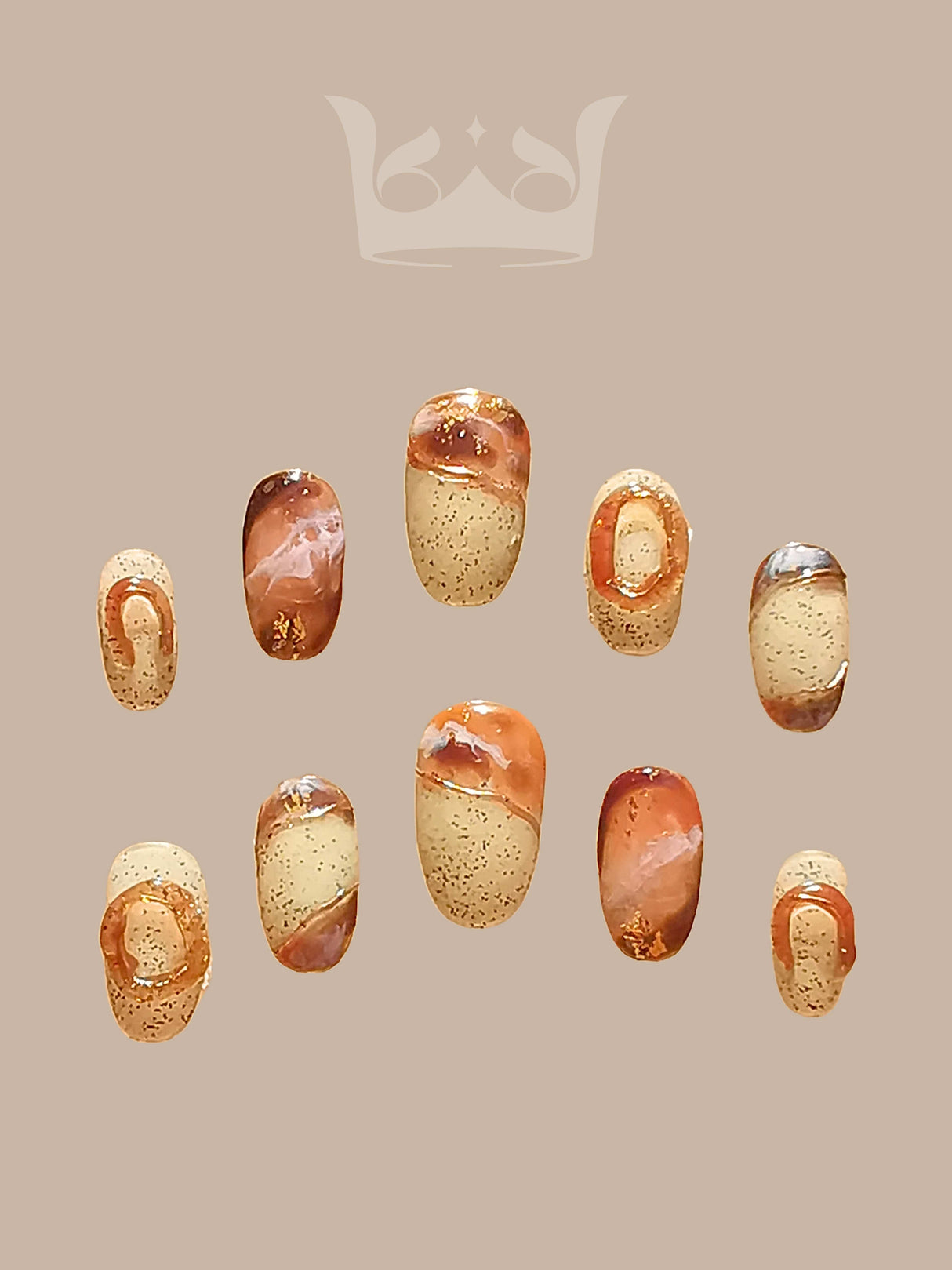 Oval medium-length press-ons with hand-painted marble effect. Painted with a netruel color pallate and stone-like background with sculpted rings.
