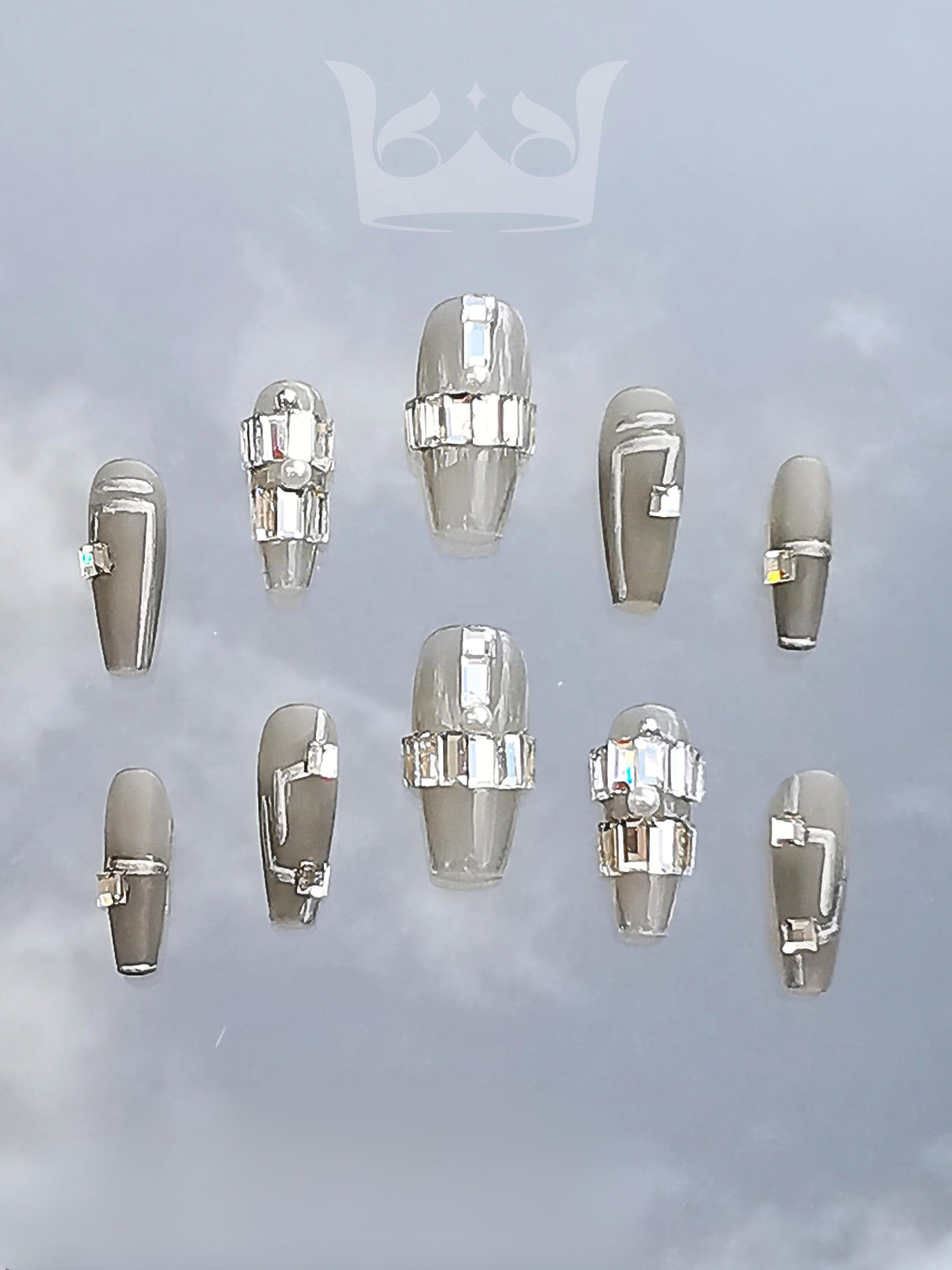 These high-end fashion nails are for those who want to make a statement with trendy designs, pearls, rhinestones, and chains.