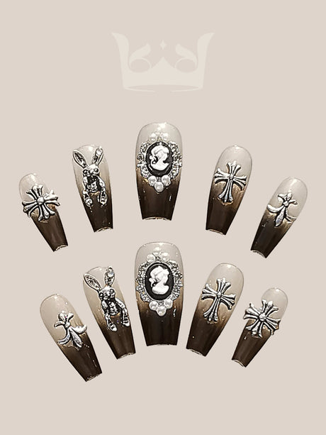 Che Naildid Black press on nails with cross ornaments and gradient design. Looks classic and elegant. 