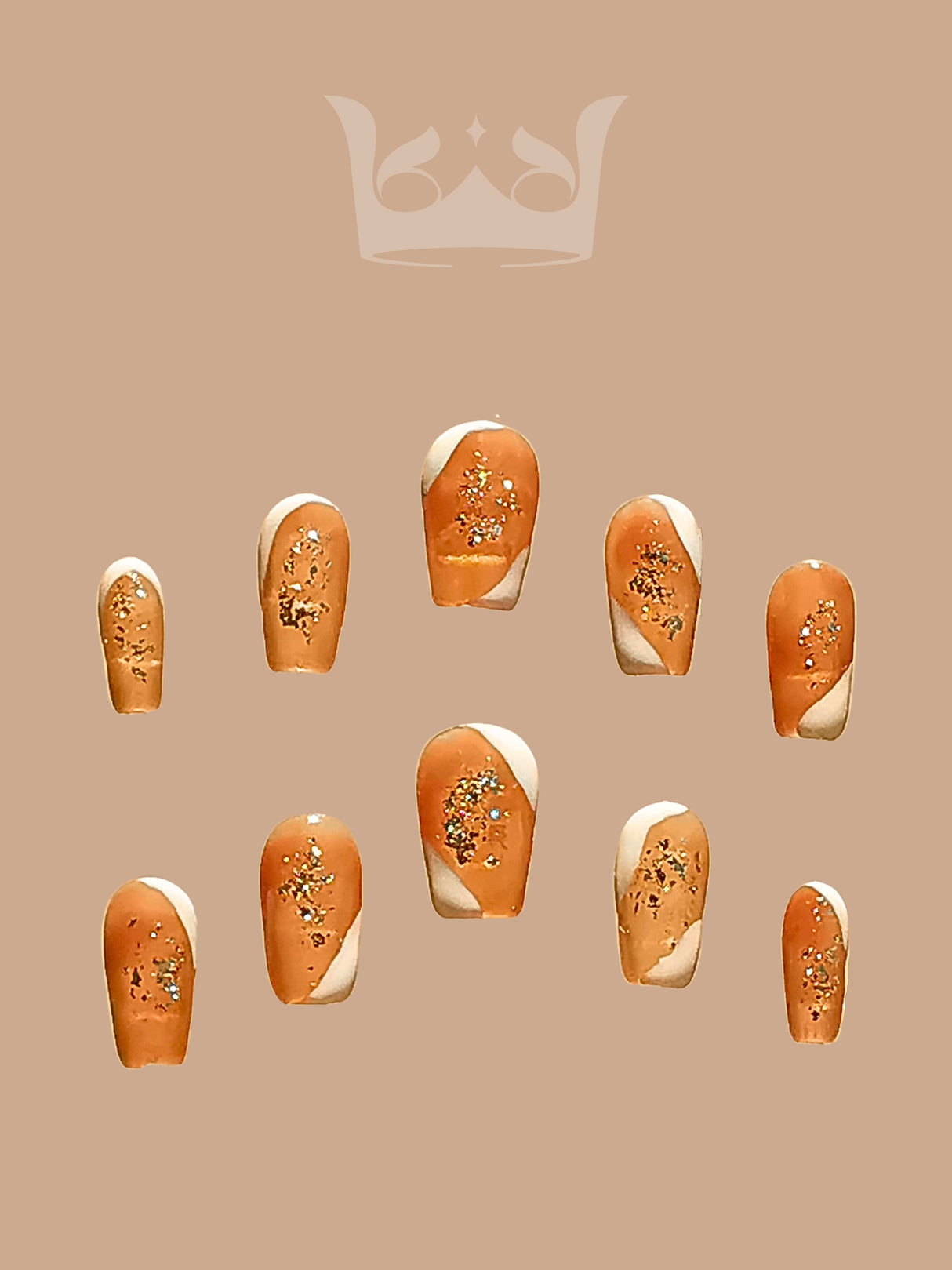 These press-on nails are for adding glamour and elegance to hands. They have a warm, peach or nude base with gold glitter.