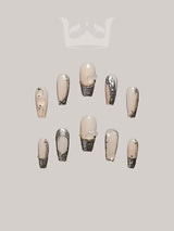 Luxurious nails with neutral color palette, glitter, 3D embellishments, diamonds, metallic elements, and sculptural art for special occasions or fashion statement.