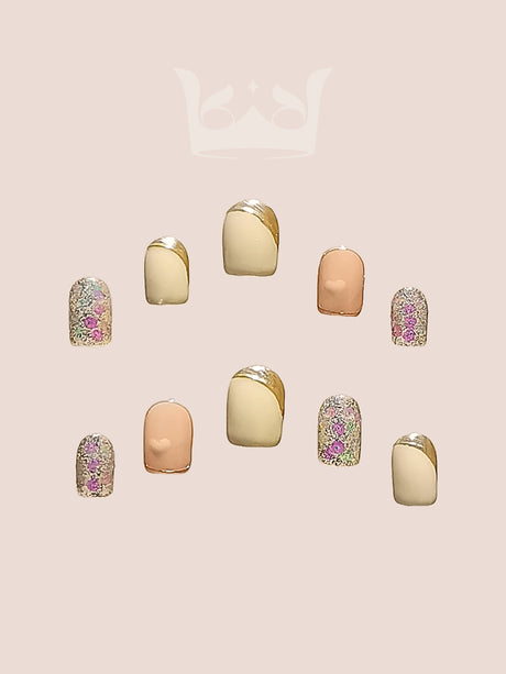 These press-on nails offer a stylish and elegant option with a neutral base color and gold accents suitable for everyday wear or special events. The oval or almond shape is popular and feminine.