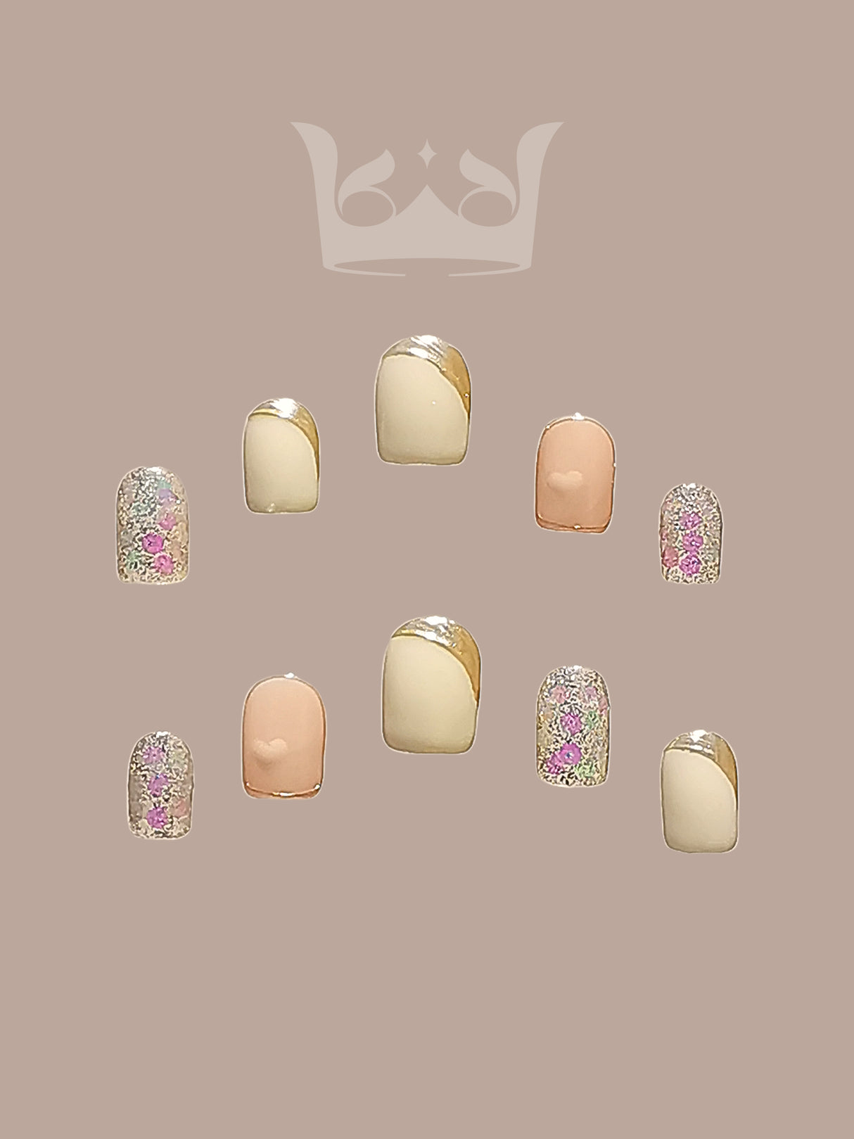 These press-on nails offer an elegant and modern twist on the classic French manicure with a nude base, gold accents, and iridescent flakies for a glittery look. 