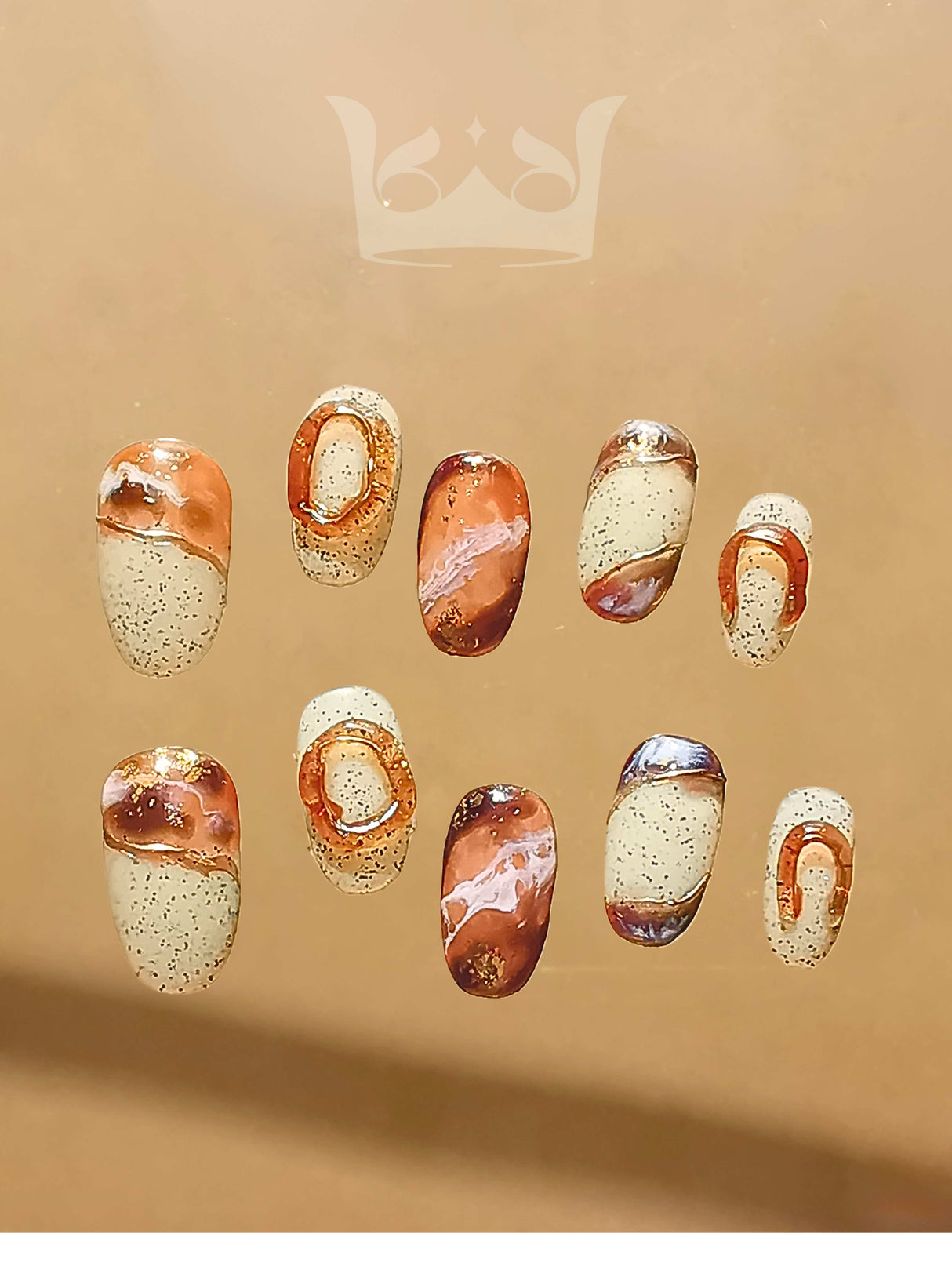 Oval medium-length press-ons with hand-painted marble effect. Painted with a netruel color pallate and stone-like background. Best nail art design in 2024.