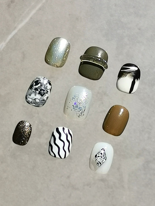 Cute nails for personal expression, popular trend in beauty industry. Includes metallic finishes, glitter, patterns, ombre effects, and bold designs.