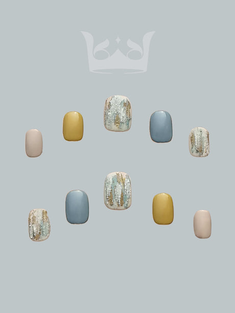 These acrylic nails are for personal fashion and style. The design includes pastel and muted tones, matte and glossy finishes, and glittery accents. 