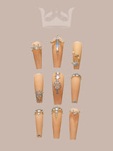 These press-on nails are for a bold and stylish look with a two-tone color scheme, rhinestones, stiletto/almond shape, and glossy finish, perfect for special occasions.