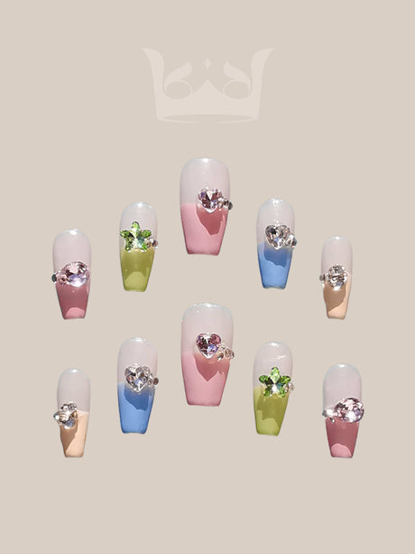 These press-on nails are  for a special occasion, with a cool-toned color scheme, glitter, marble effect, gold accents, and glossy finish for a fancy look.