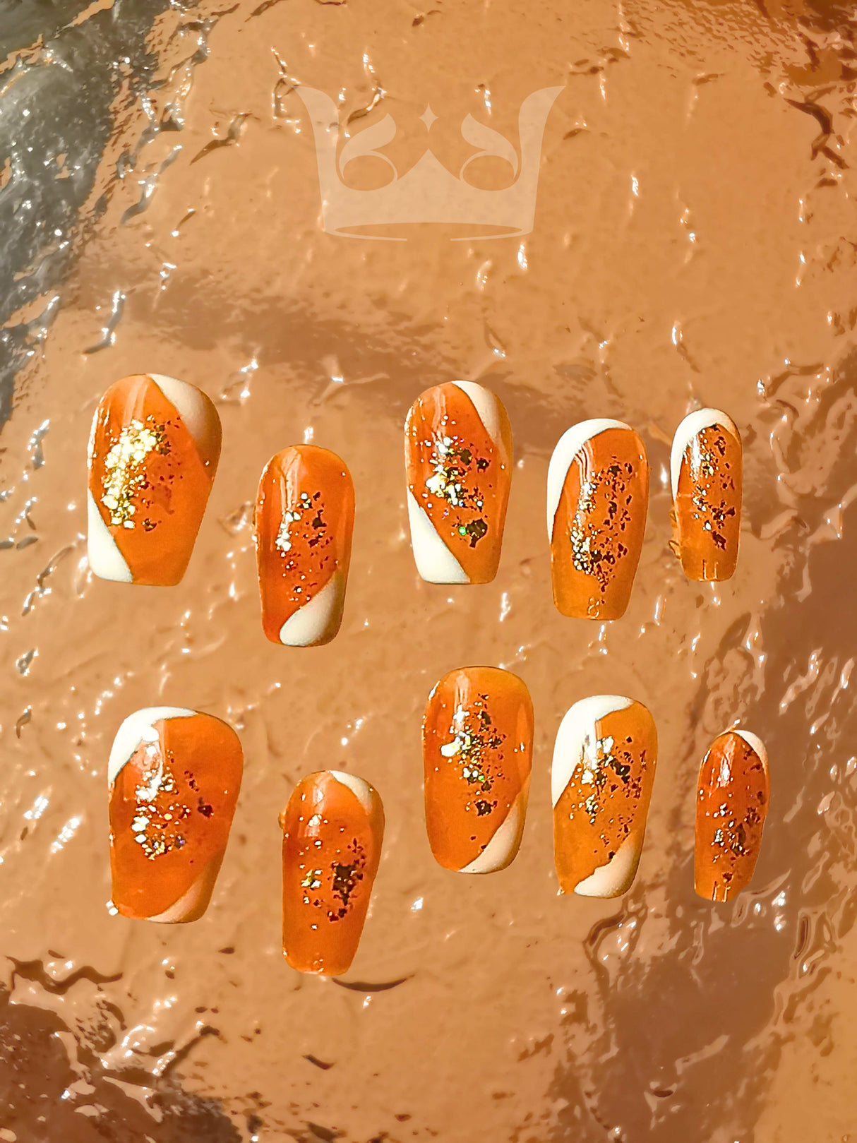Sparkly and festive nails with gold glitter, star-shaped embellishments, and orange base color are perfect for adding glamour to a special occasion outfit.