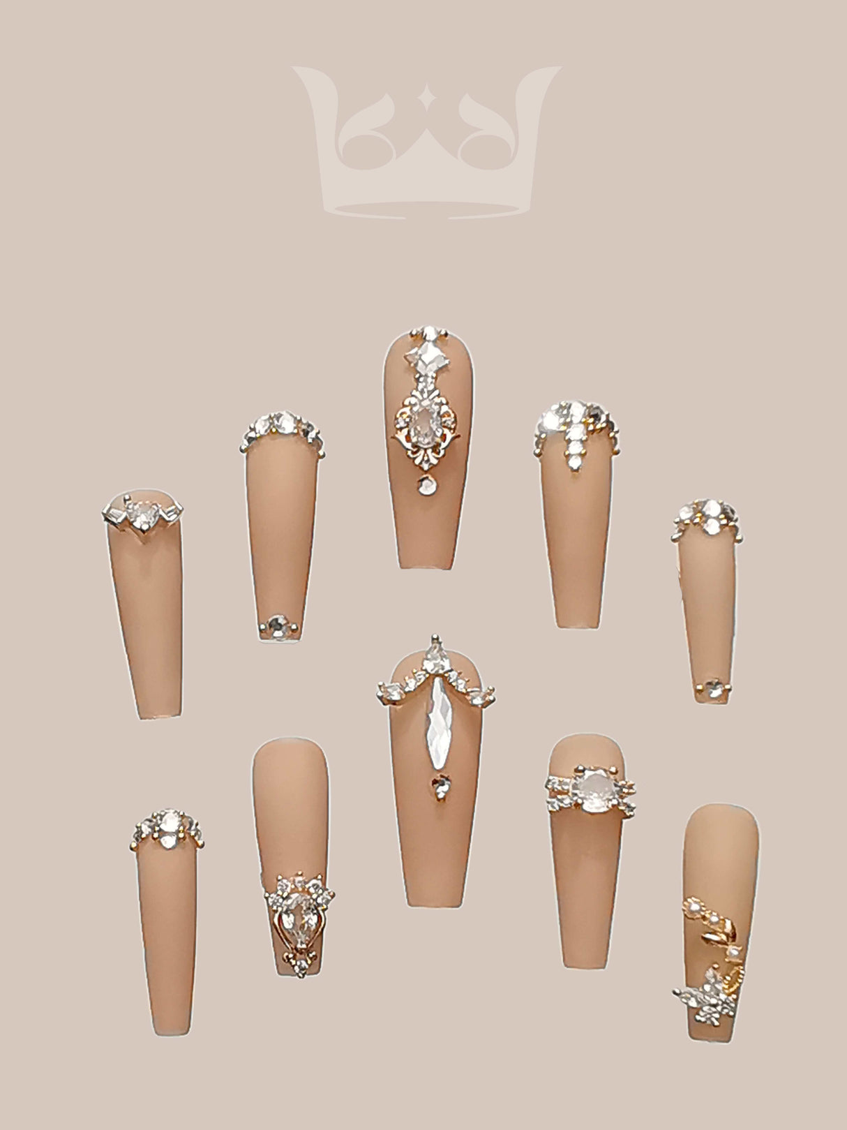 Opulent and glamorous nails with rhinestones, metallic accents, and pearls for special occasions. Neutral polish provides a subtle backdrop for the ornate decorations.