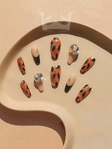 These press-on nails are for a bold and stylish look with a two-tone color scheme, rhinestones, stiletto/almond shape, and glossy finish, perfect for special occasions.