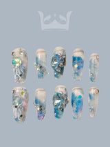 These acrylic nail tips are designed for trendy nail art with a cool-toned color palette and water/ice theme, including glitter, diamonds, and foil. 