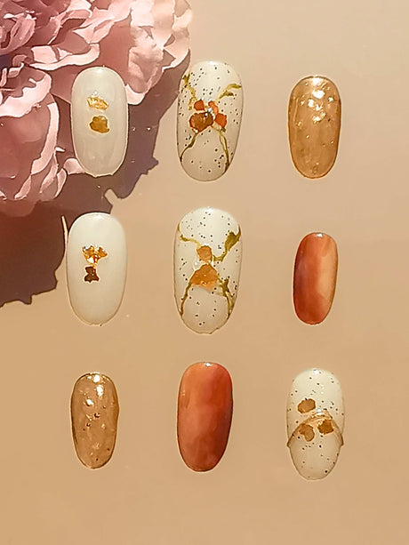 These luxurious and fancy acrylic nails with gold embellishments are perfect for special occasions or fashion events to make a bold statement.
