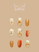 These cute nails are designed for special occasions with a color palette of gold and cream, glittery or metallic finishes, and cute elements. Ideal for adding glamour to events.