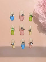 These press-on nails are a fashion accessory combining nail art and jewelry for a unique and stylish look.
