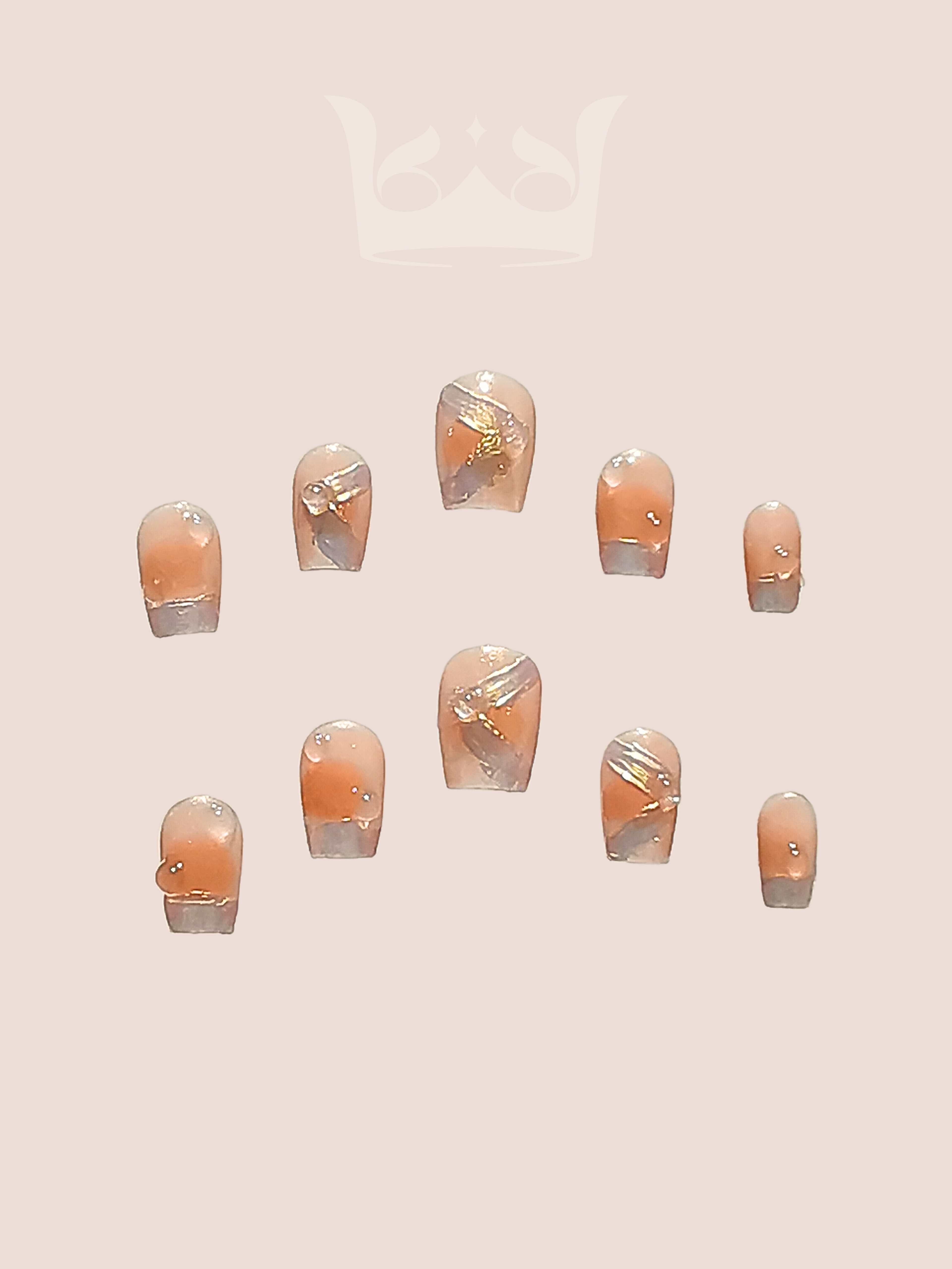 These press-on nails are perfect for special occasions, with a neutral base color and subtle embellishments that match a variety of outfits. They come in glossy finish for a polished look.