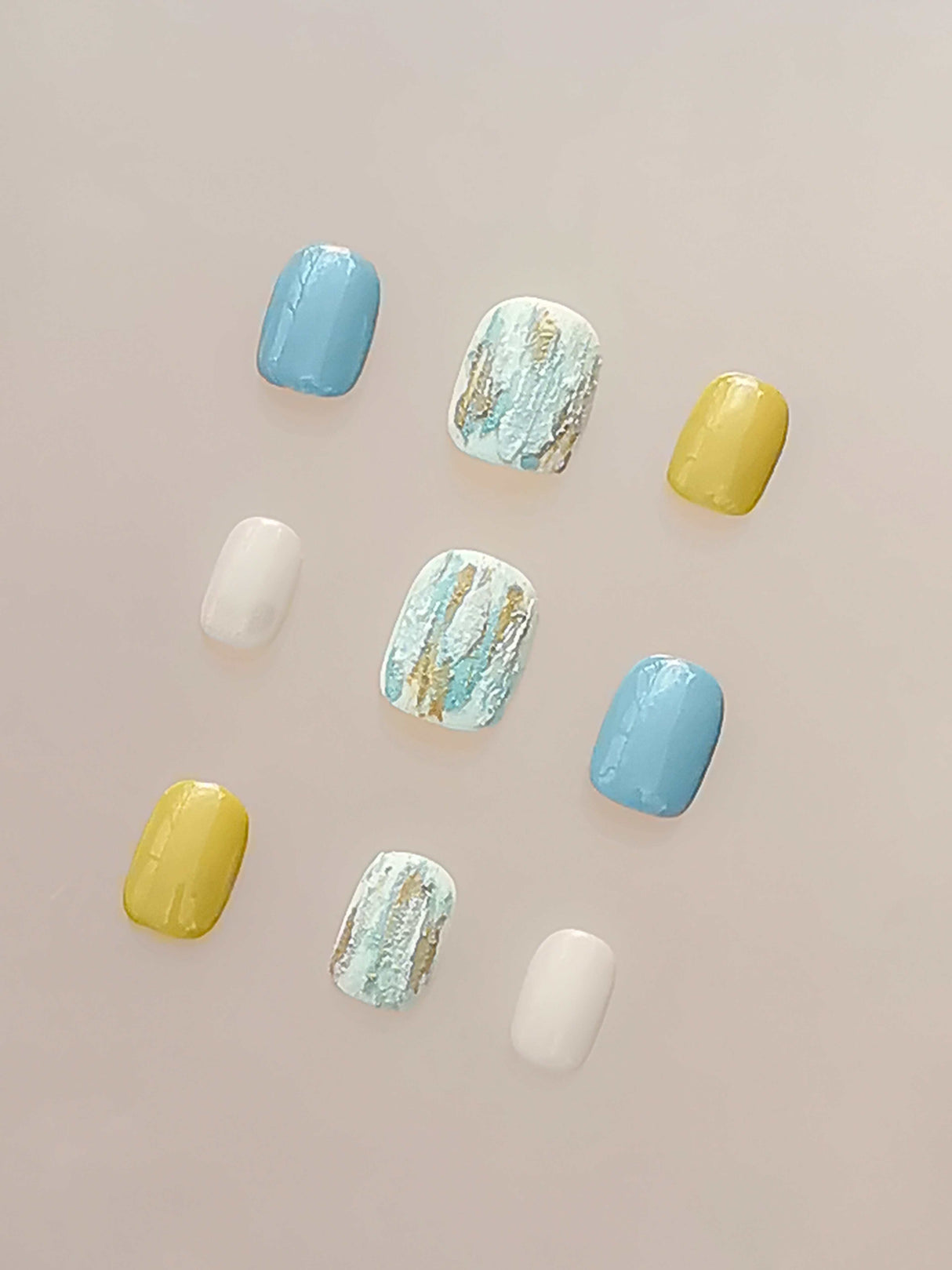 Luxury nails with various designs and colors for personal fashion and style. Metallic embellishments add uniqueness and edginess to enhance appearance.