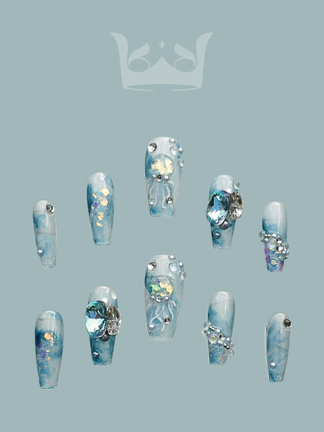 Luxurious and ornate acrylic nail tips for nail art enthusiasts. Different lengths and shapes with glitter, sequins, and diamonds for elegance.