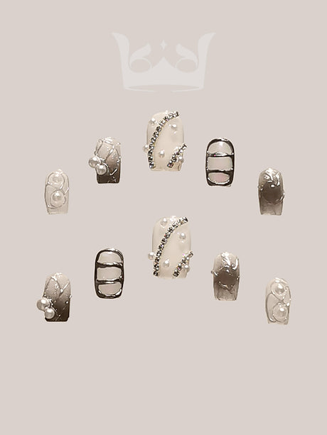 These ornate acrylic nails with embellishments, metallic accents, and 3D elements are perfect for special occasions or making a fashion statement.