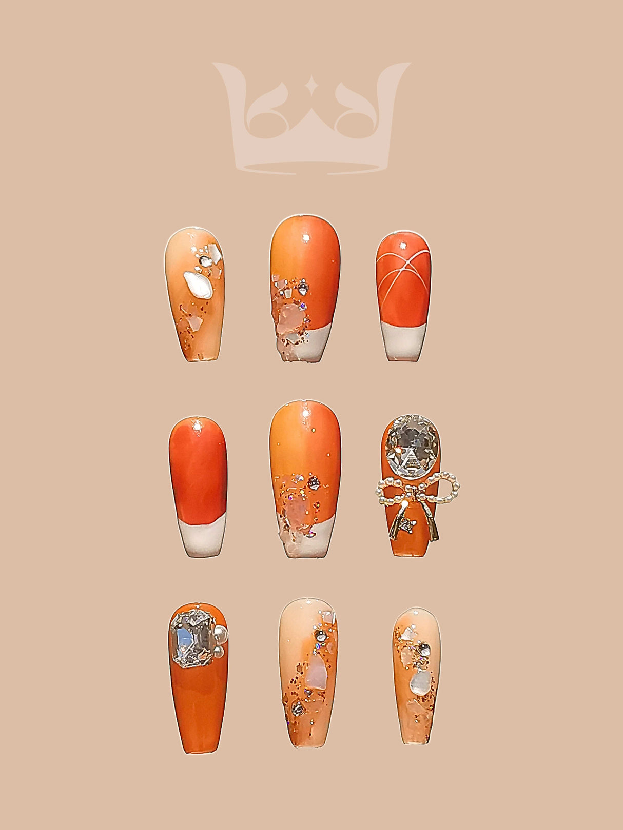 These press-on nails are perfect for a bold and glamorous look with orange and peach tones, floral motifs, glitter accents, and rhinestone embellishments.