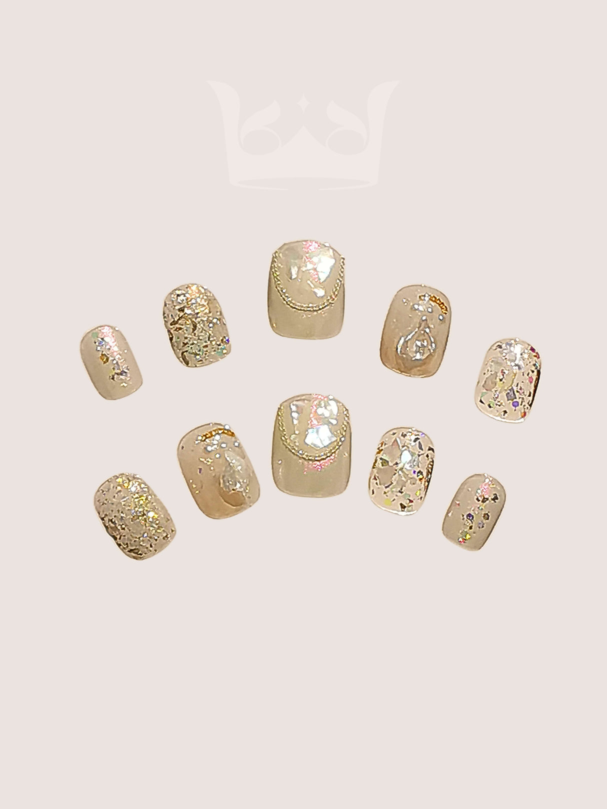 Glittery and sparkly nails with irregularly shaped flakes and warm-toned colors are perfect for special occasions, creating a luxurious and festive look.