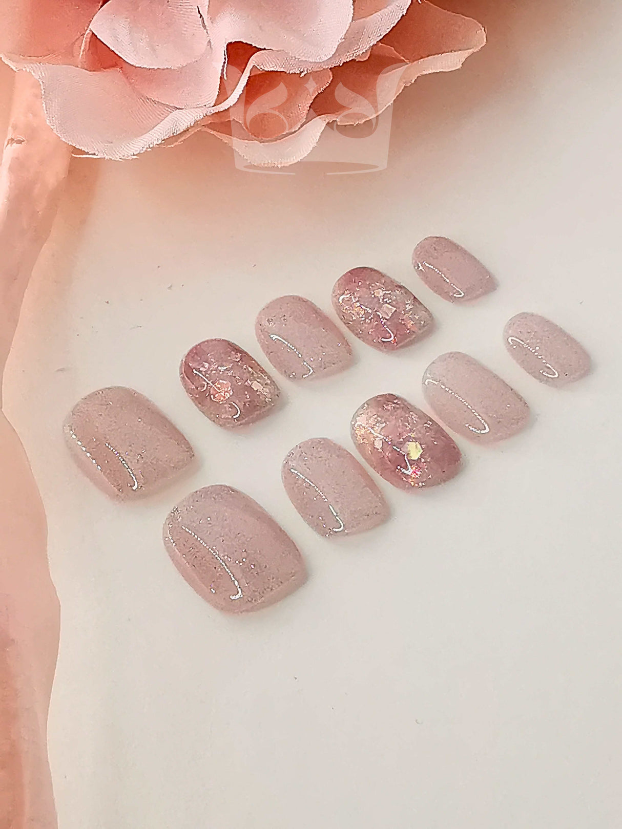 These press-on nails are for fashion-forward individuals who want to make a statement. They feature a fancy design with metallic accents and would add a touch of luxury