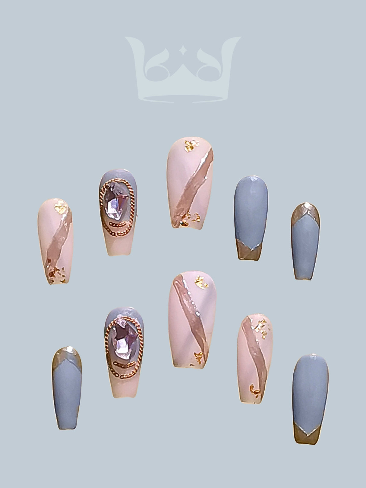 Luxurious and elegant nails with metallic gold foil accents and gemstone embellishments for special occasions or fashion statements. Coordinated and stylish.