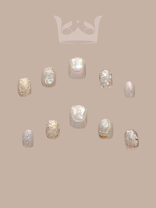 Glamorous and delicate nails with glitter, iridescent accents, and pastel colors are perfect for special occasions or as statement nail art. Suitable for feminine and elegant styles.