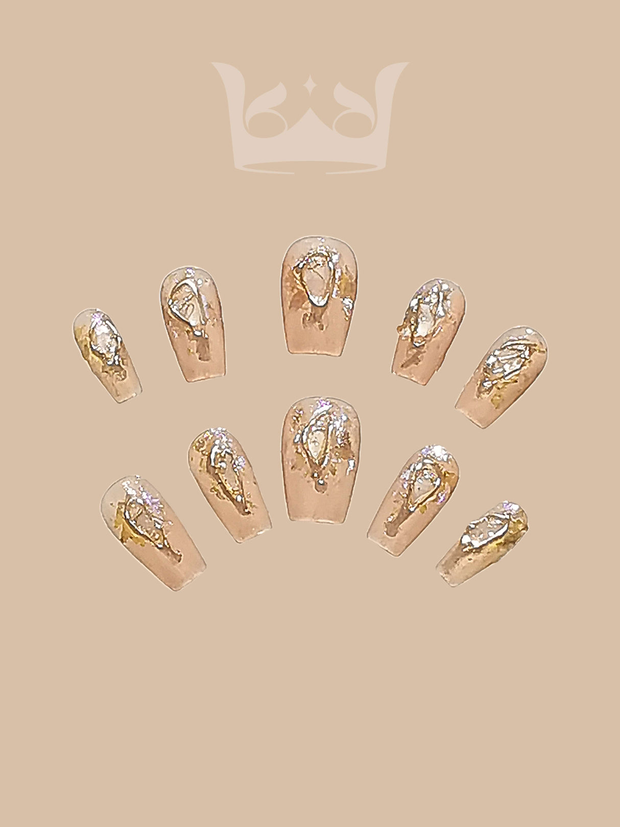 Chic and versatile nails with nude base and gold foil accents towards tips, rounded/oval shape, suitable for everyday/formal occasions. Elegant and eye-catching.