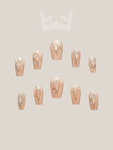 These press-on nails are perfect for special occasions with an elegant and modern design, varying lengths, and gold accents. They add glamour to any outfit.
